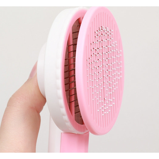 Пуходёрка пластиковая с функцией самоочистки 7,7х19,1см, розовая арт.9001563 Китай